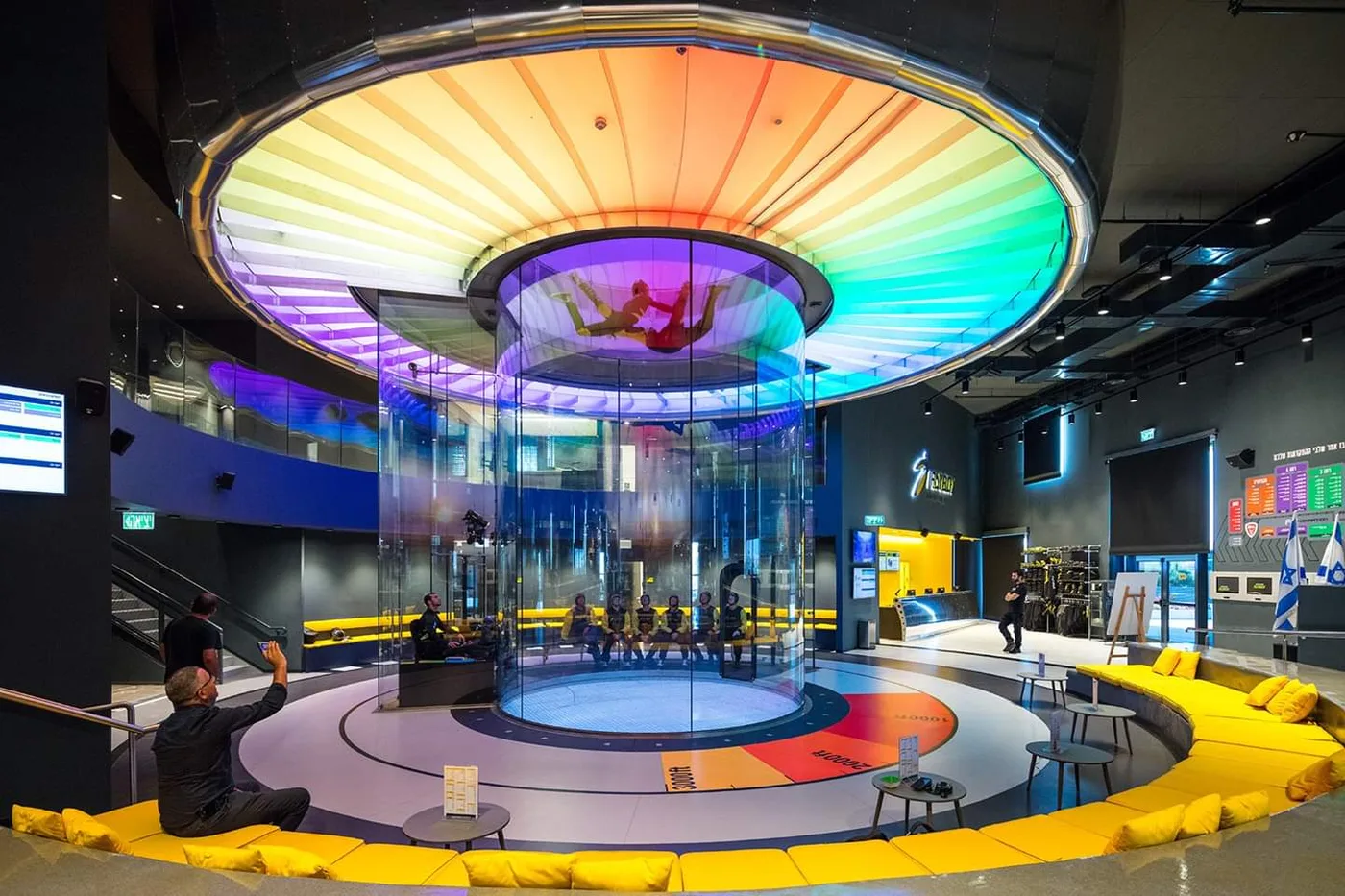 Vertical wind tunnel flight chamber with illuminated multicolor ceiling — Tel Aviv, Israel